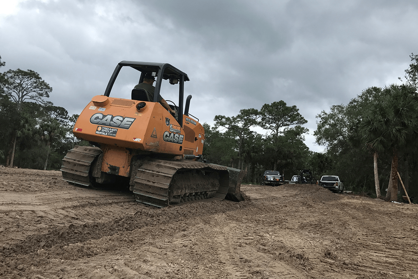 Case bulldozer moving dirt on a hillside
