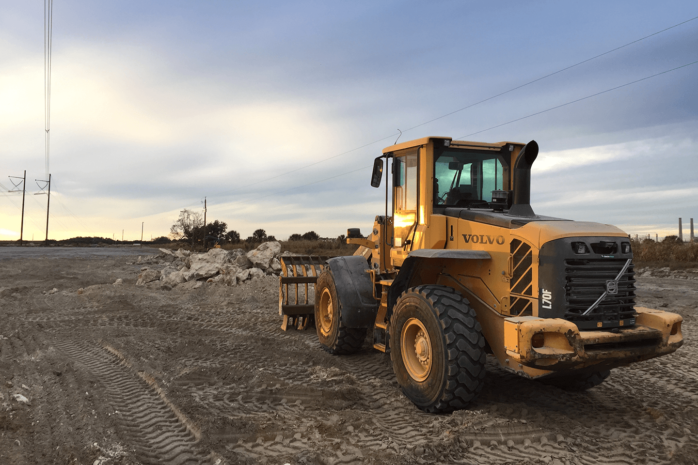 Volvo front end loader moving dirt and rock