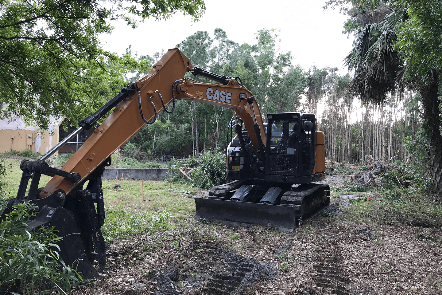 Case excavator moving brush