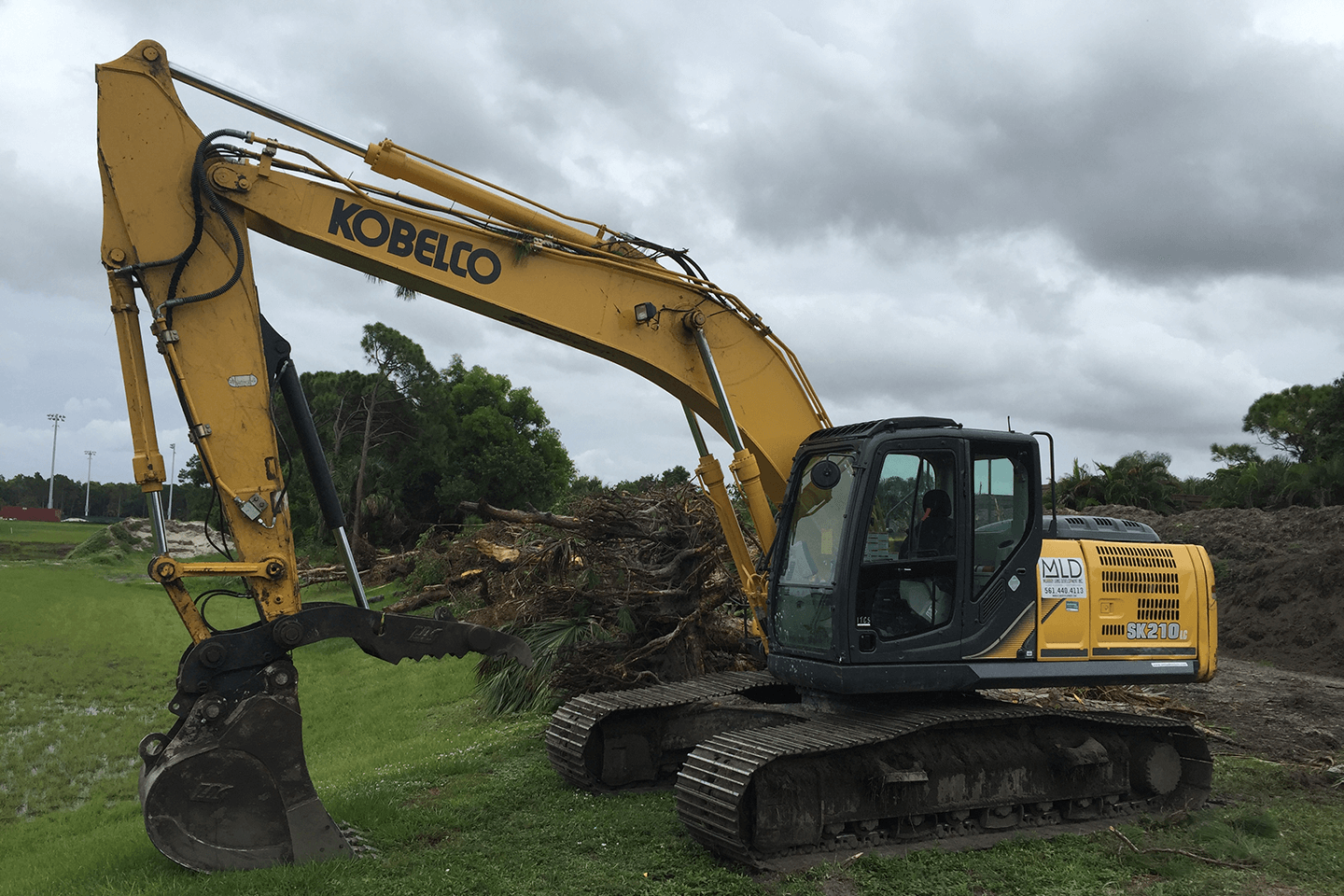 Kobelco excavator moving brush