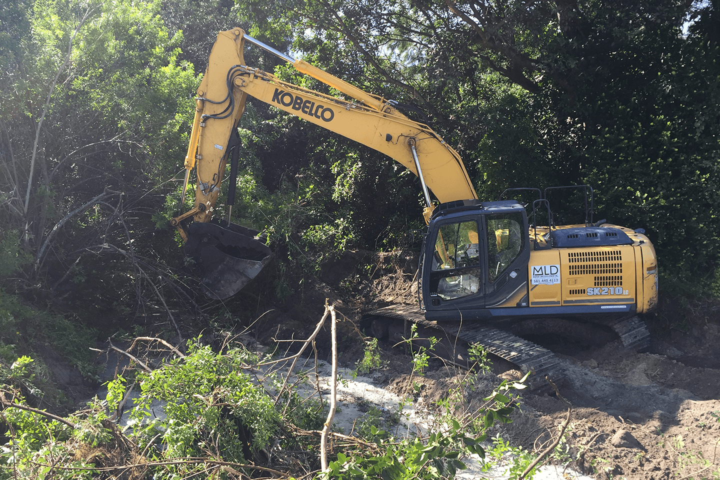 Kobelco excavator moving brush
